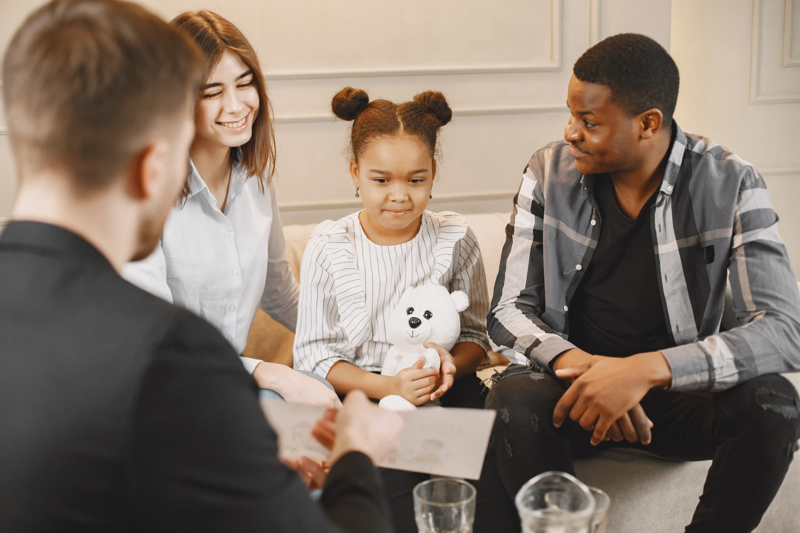 Family therapy session in Norcross, GA with parents and child meeting together with a licensed marriage and family therapist